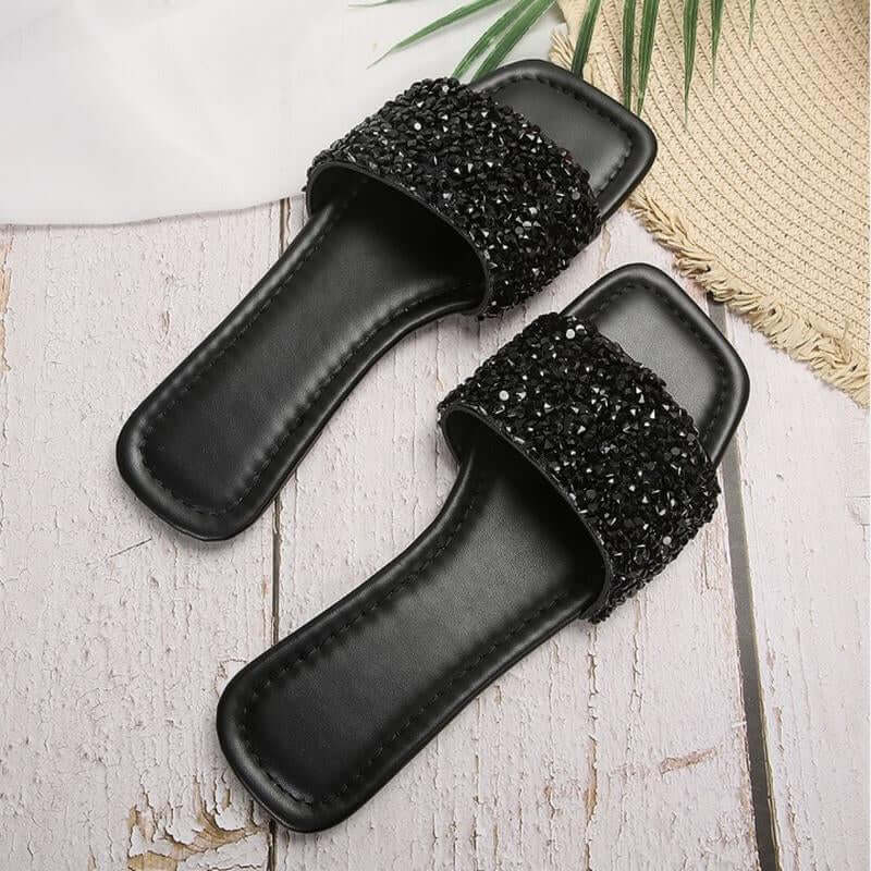 Chic black rhinestone women’s slippers, open toe flat sandals for casual summer beach wear.