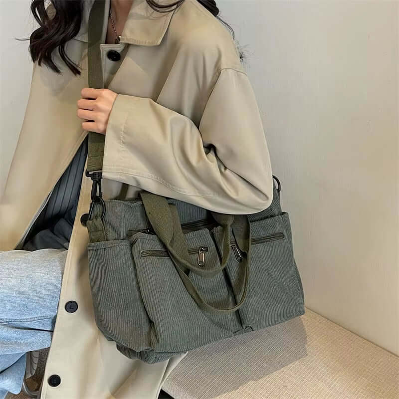 Fashionable women’s large capacity corduroy tote bag in olive green, perfect for commuting or everyday use.