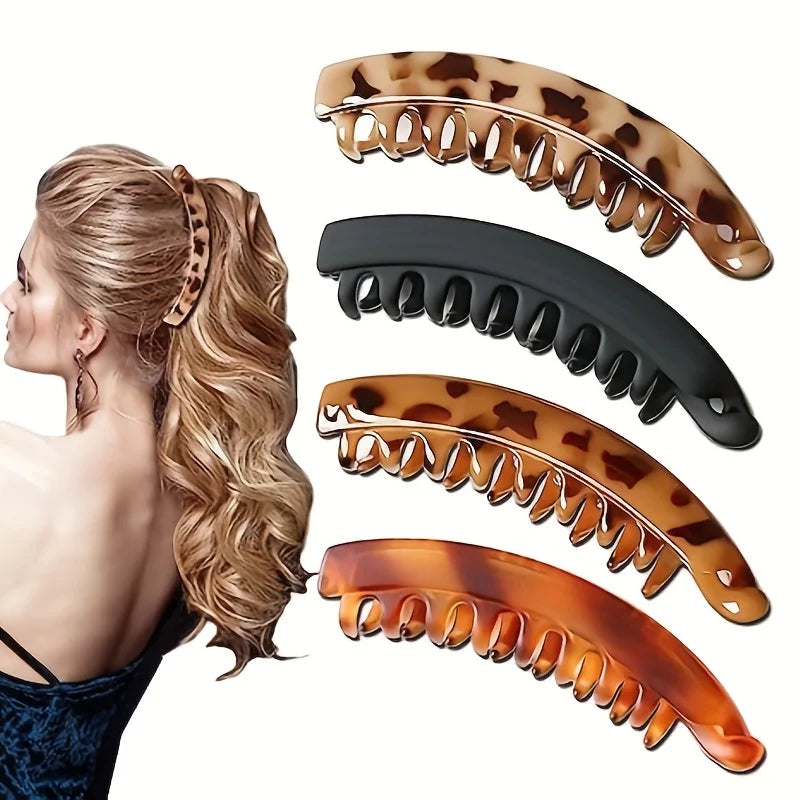 Matte fish-shaped banana hair clips in various colors for women, ideal for ponytails and stylish hairdos.
