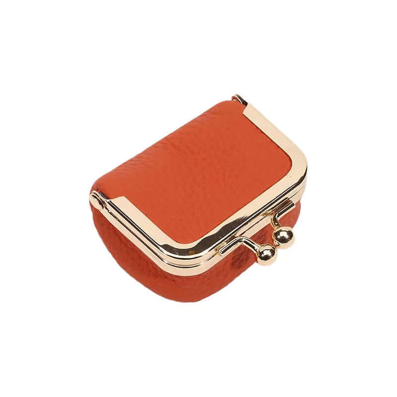 Orange PU leather mini coin wallet with gold kiss lock closure for jewelry storage.