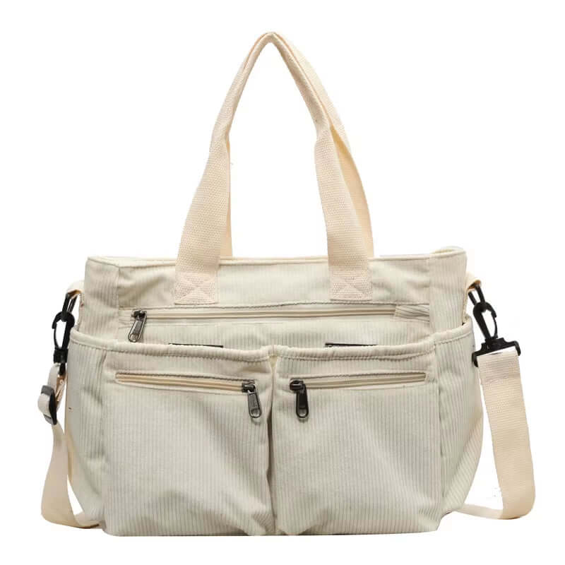 Large capacity cream corduroy tote bag with multiple pockets, stylish shoulder and crossbody straps for women.