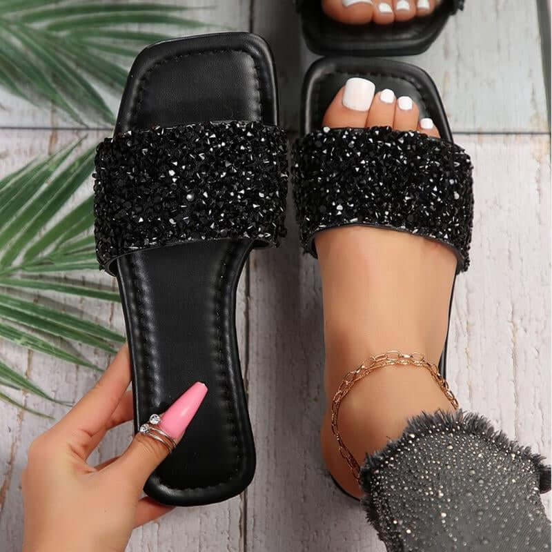 Chic black rhinestone sandals with open toe, perfect for summer casual wear and beach outings.