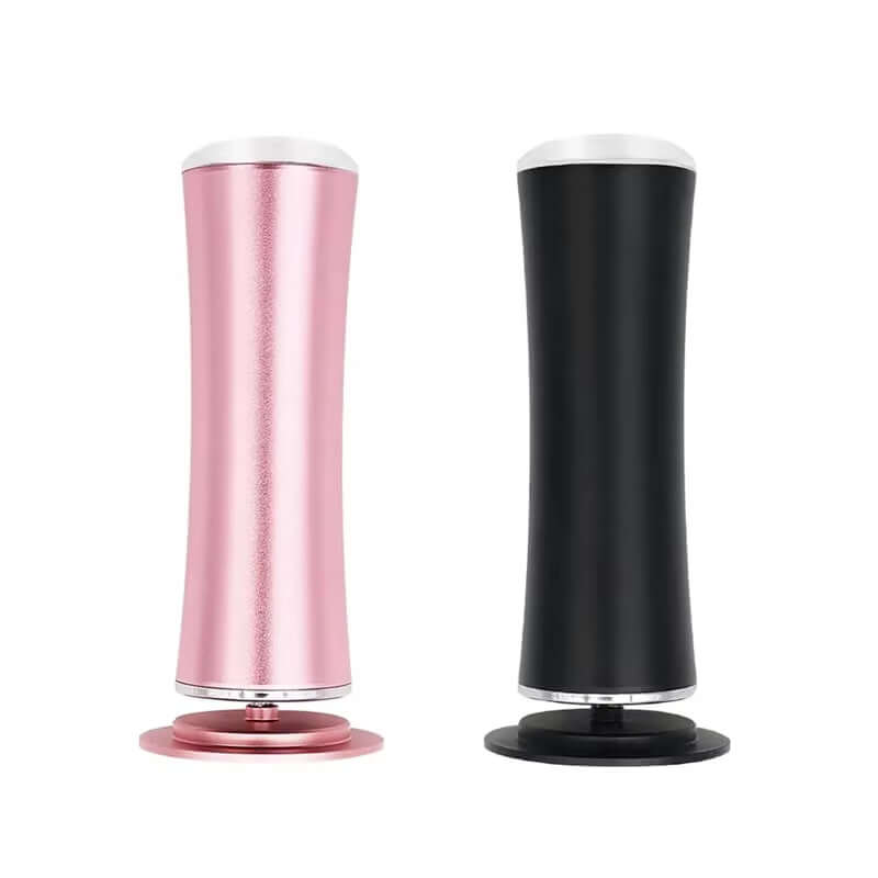 USB electric foot grinder in pink and black for exfoliating dead skin and pedicure.