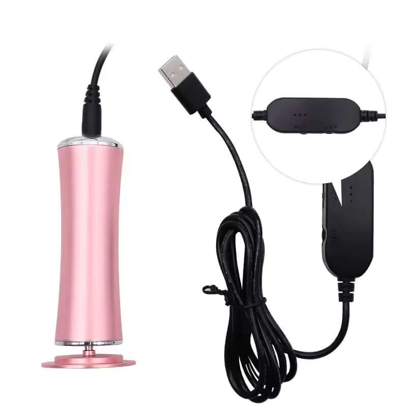 USB electric foot grinder and exfoliating machine in pink with charging cable for pedicure.