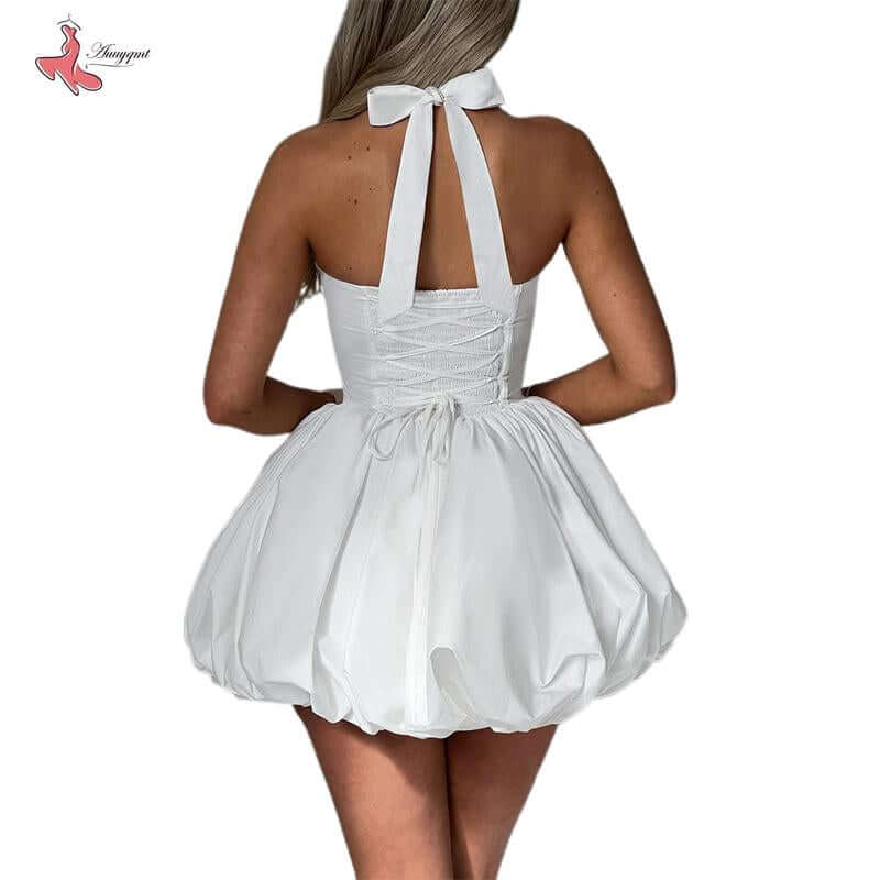 Back view of a women’s sleeveless halter dress with a tie-up back and bubble hem, ideal for summer casual wear or parties.